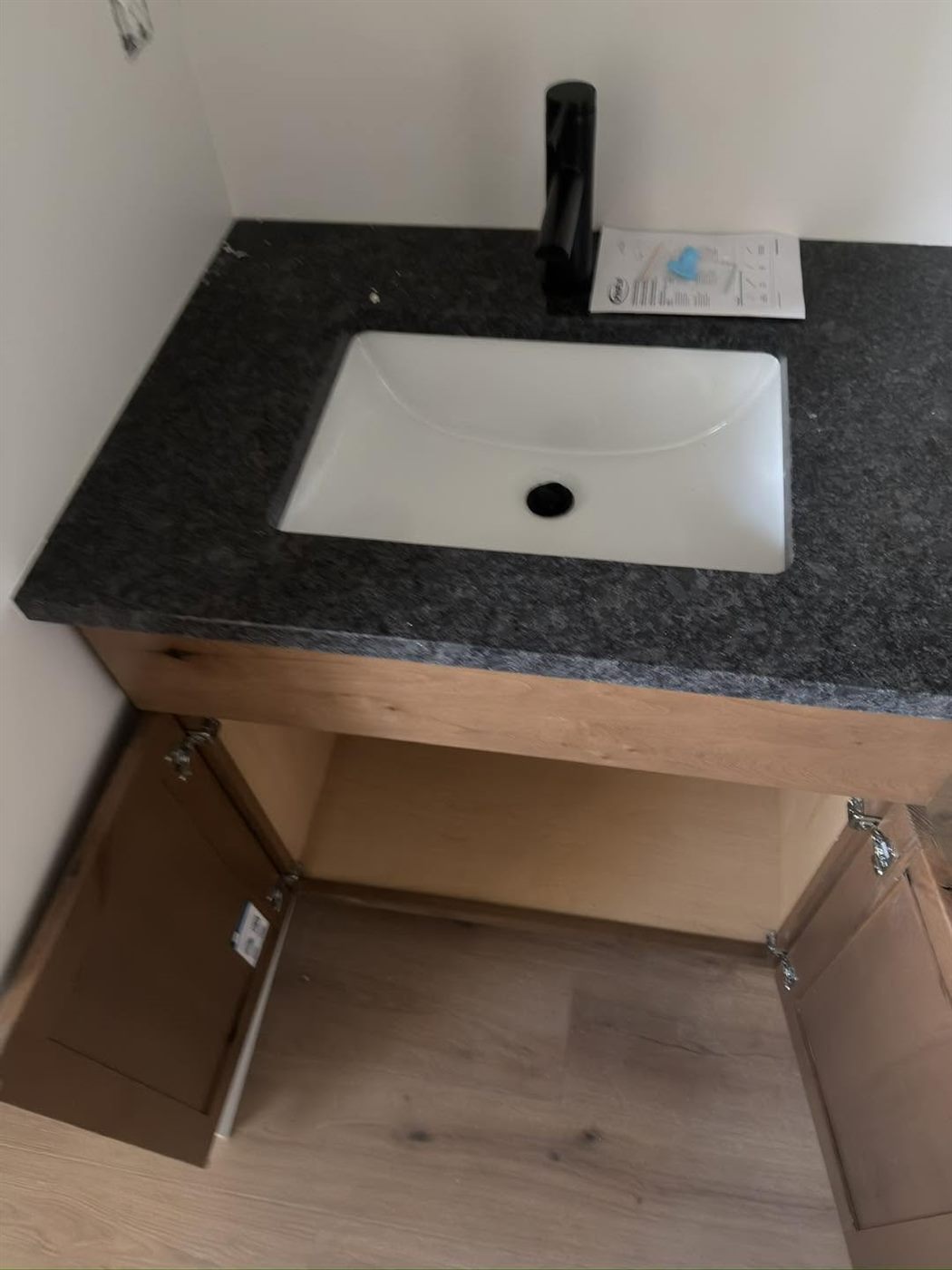 Finished bathroom vanity with a stone top