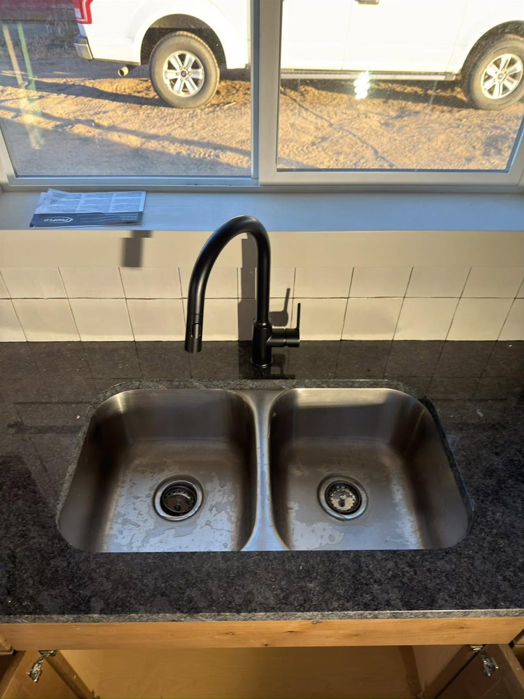 New double kitchen sink and black faucet