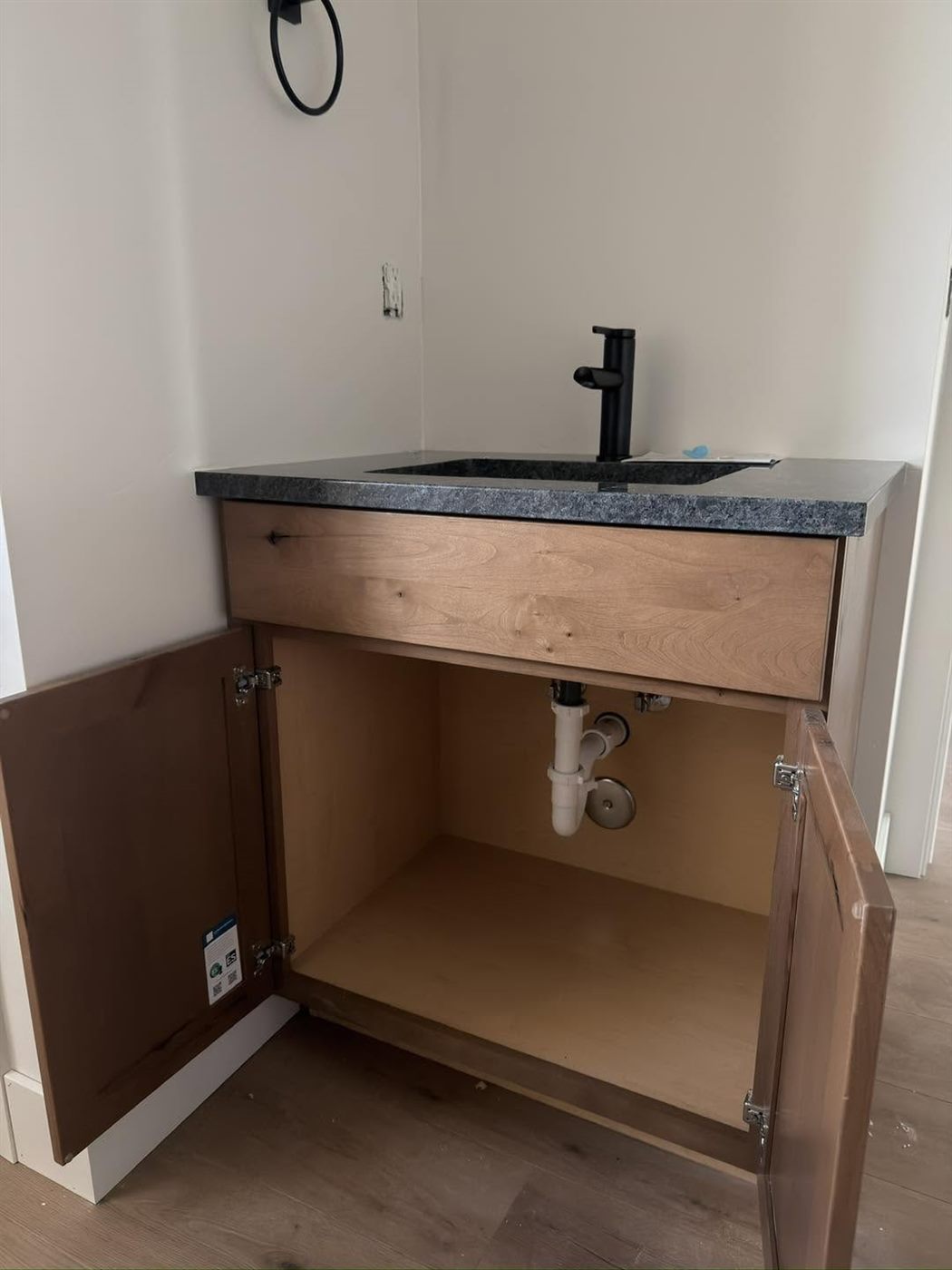 Bathroom vanity with under-cabinet plumbing
